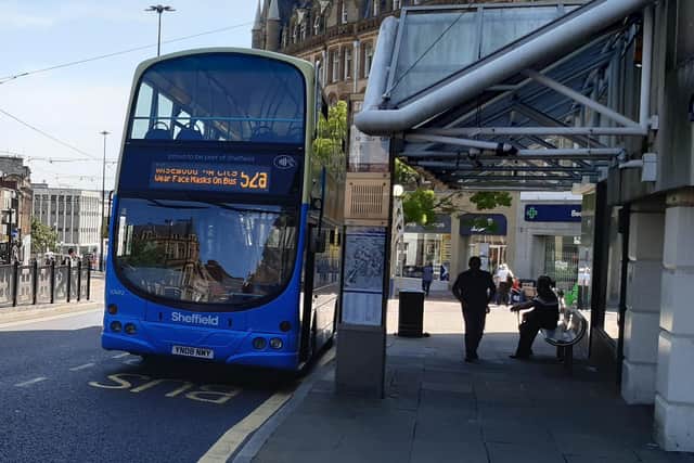 Bus and tram fares will be capped in Sheffield from next month. A bus is pictured at the bottom of Fargate