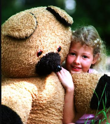 Seven year old Charlotte Murphy from Intake enjoying a teddy bear picnic in Sandall Beat Woods in July of 1997.