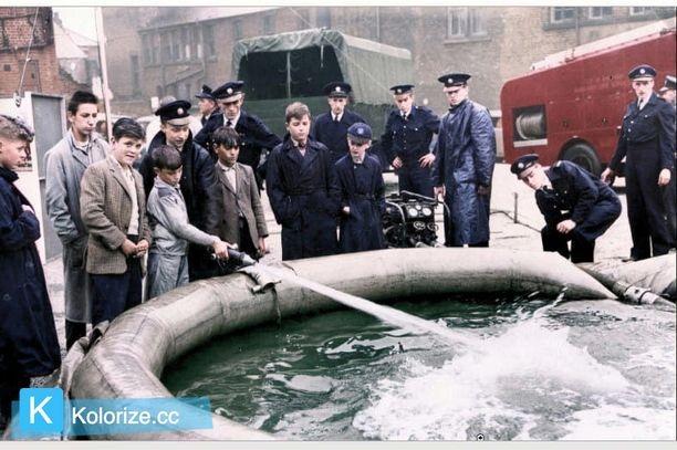 The Sheffield Auxiliary Fire Service gave an exhibition on the Moor and our picture shows young visitors trying their hand at one of the hoses into the portable dam, October 7, 1961. PIcture: Sheffield Newspapers