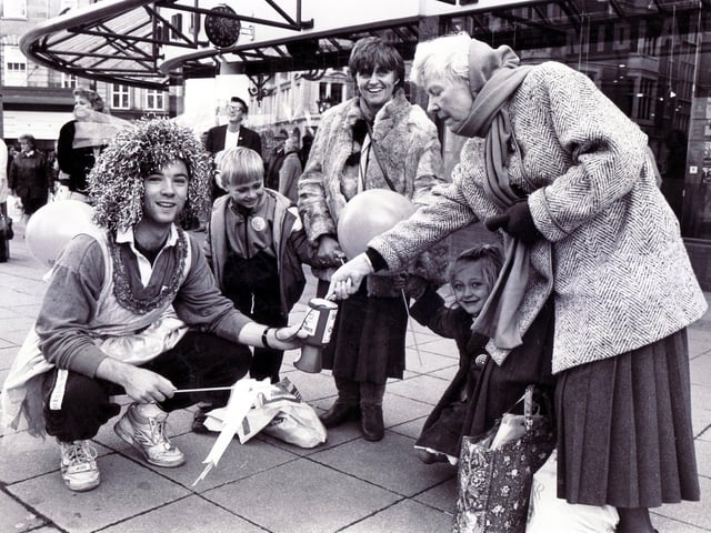 The University Rag Day Parade 1990 - a student in fancy dress collecting money in High Street, Sheffield