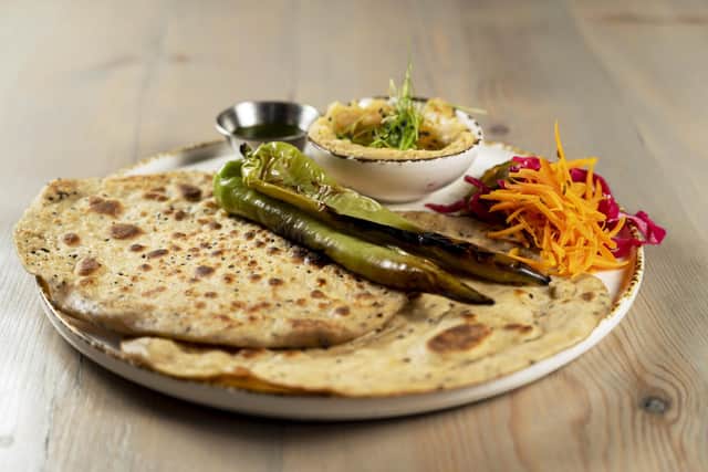 Za’atar flatbreads, which were served with a fava dip; house pickles and ferments; grilled Turkish peppers and herb oil. Picture: Scott Merrylees