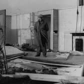Joe Platts pictured in the remains of his prefab home in Skye Edge, damaged by the hurricane that hit Sheffield on February 16, 1962