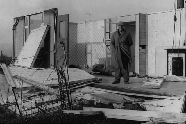 Joe Platts pictured in the remains of his prefab home in Skye Edge, damaged by the hurricane that hit Sheffield on February 16, 1962