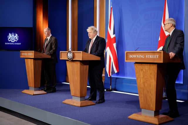 (left to right) Chief medical officer Sir Chris Whitty, Prime Minister Boris Johnson and Chief scientific adviser Sir Patrick Vallance during a media briefing in Downing Street, London, to outline the Government's new long-term Covid-19 plan.  Photo: Tolga Akmen/PA Wire