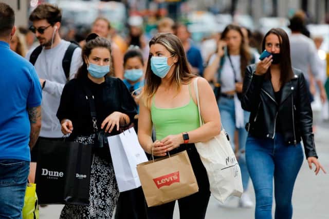 Masks are mandatory in many indoor places, including shops (Photo by Tolga AKMEN / AFP) (Photo by TOLGA AKMEN/AFP via Getty Images)