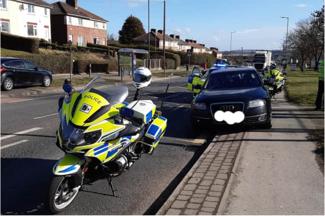 Police officers pulled over a car in Kimberworth and issued Covid fines as well as  arresting two passengers on suspicion of immigration offences