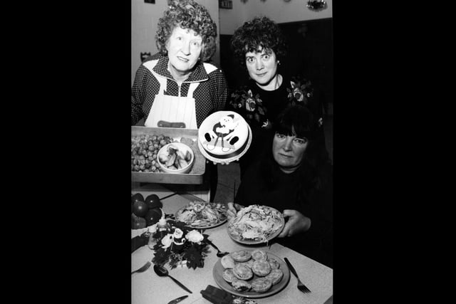 Members of Friends of the Homeless in Fareham show off the Christmas meal they prepared for the homeless at St Phillip Howard Church Hall, December 27 1993. The News PP3454