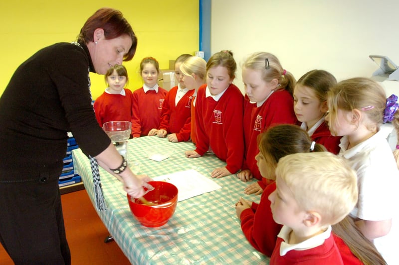 Teaching assistant Karen Qill instructing the lunchtime cookery club at Plains Farm Primary School on the finer points of making chocolate muffins. Remember this from 2008?