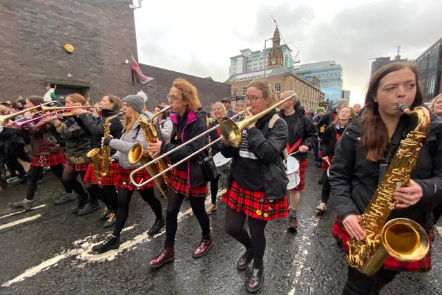 Musicians were playing as crowds marched through Glasgow on Saturday.
