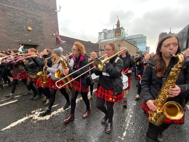 Musicians were playing as crowds marched through Glasgow on Saturday.