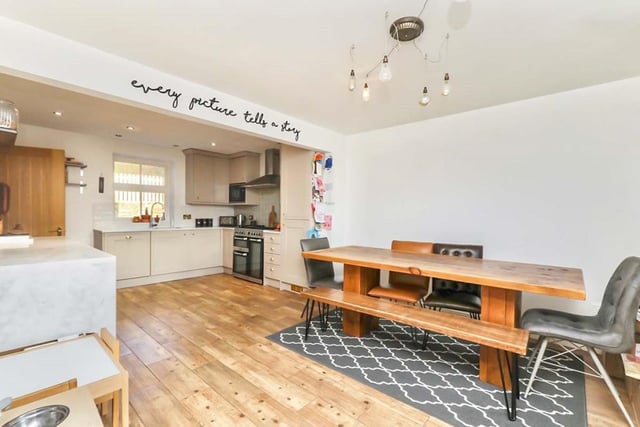 'Every picture tells a story', says the message - and this one certainly does as it portrays an attractive kitchen/diner. It boasts a range of wall and base units, and is so spacious there is lots of room for a breakfast and/or dining table.