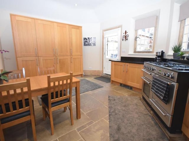 A second view at the kitchen diner, which boasts high-end appliances, including a Rangemaster cooker incorporating a double oven, grill, pan drawer, plate warmer and five-ring gas hob with wok stand. As you can see, the generously-sized room has space for a dining table and chairs.