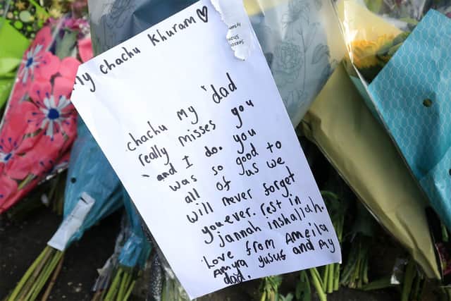 Flowers and balloons have been left at the spot where a Sheffield solicitor was gunned down in the city.
Picture: Chris Etchells