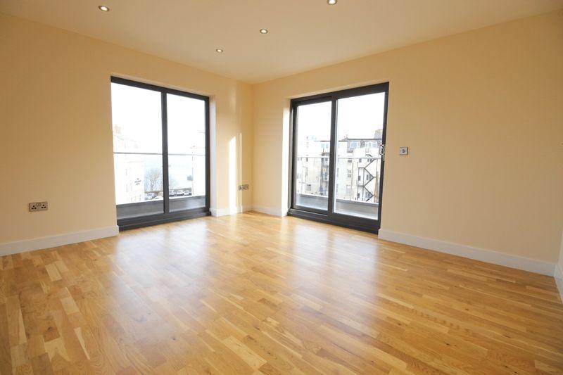 With ensuite and sliding doors onto the balcony.