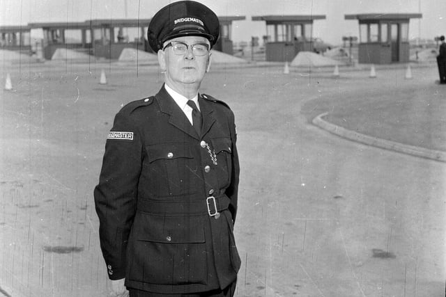 Mr R Wilson, the first Forth Road Bridge Master, in front of the tollbooths in 1964.