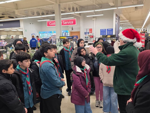 39th Scouts listen as Tricia from Burngreave Foodbank gives a briefing for the day’s collection.
