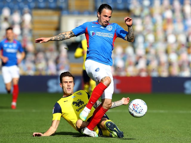 Ryan Williams is challenged by Josh Ruffels of Oxford United