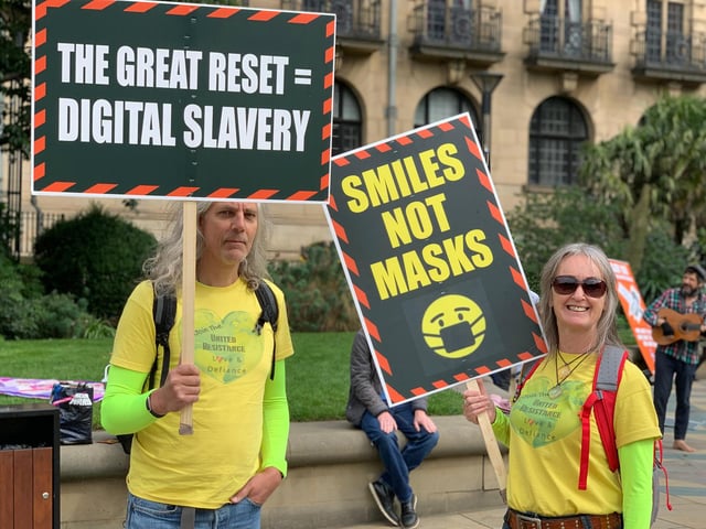 People carried homemade banners and signs at the protest