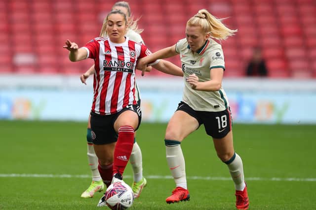 Maddy Cusack battles with Ceri Holland of Liverpool during the The FA Women's Championship match at Bramall Lane, Sheffield. Photo: Simon Bellis/Sportimage