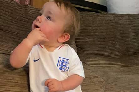 James, age 1, anxiously waiting for kick-off.