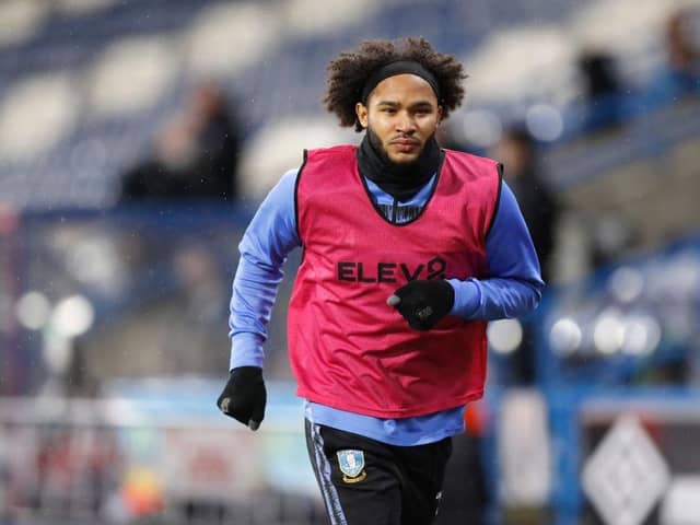 HUDDERSFIELD, ENGLAND - DECEMBER 08: Izzy Brown of Sheffield Wednesday warms up on the sideline during the Sky Bet Championship match between Huddersfield Town and Sheffield Wednesday at John Smith's Stadium on December 08, 2020 in Huddersfield, England. (Photo by George Wood/Getty Images)