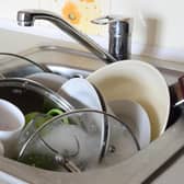 Over 8,000 homes in Sheffield are overcrowded, according to latest figures. File pIcture shows dishes piled up in a sink