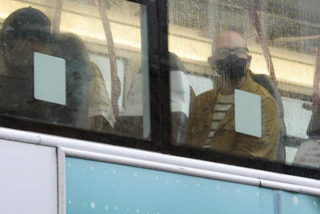 Public transport users in South Yorkshire wearing masks as they travel by bus.