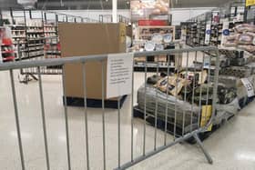 A notice informing customers of the sales of non-essential products at a Tesco Extra store in Pengam Green, Wales, which has entered a two-week "firebreak" lockdown in an attempt to protect the country's NHS from being overwhelmed by the resurgence of coronavirus.