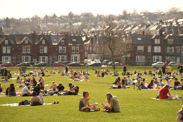 People enjoying the sunshine in Endcliffe Park in Sheffield, earlier this week as England's third Covid-19 lockdown restrictions eased at the start of the week, allowing groups of up to six people to meet outside. (Photo by OLI SCARFF/AFP via Getty Images)