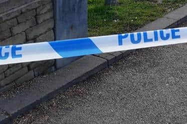 Abbeydale Road, Sheffield, was sealed off last night while emergency services dealt with a serious crash that saw a vehicle collide with a shop front. File picture shows police tape at an investigation scene