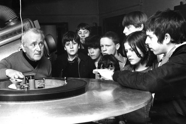 Projectionist Jim McIntosh demonstrates new projection equipment to these young newspaper deliverers who were given a trip to the cinema as a treat. But who can remember which cinema it was?