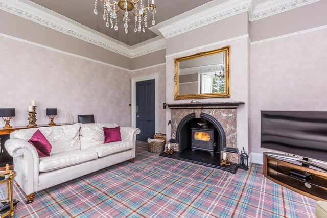 A large reception room benefitting from open views over the gardens and beyond. Ornate coving and skirting, original shutters to the windows. Feature fireplace with marble fireplace and surround and inset wood burning stove.