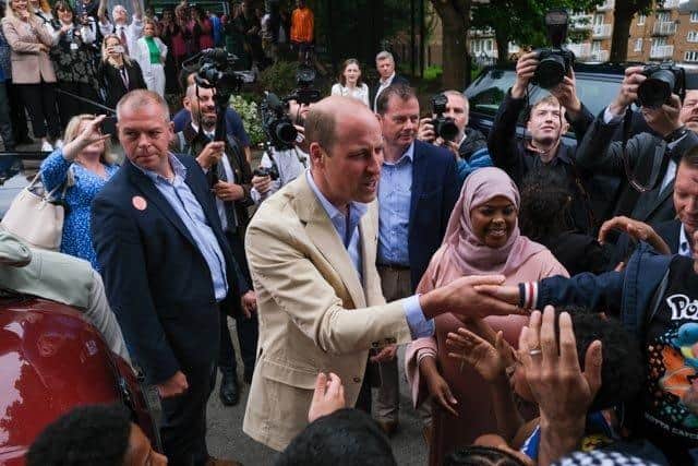 Prince William leaves the Reach Up Youth project in Burngreave after his surprise visit to Sheffield, to visit the scheme. Also in the picture is Safiya Saeed, who set up the Reach Up Youth project