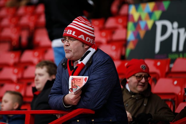 A United supporter surveys the scene ahead of the FA Cup second round tie with Oldham Athletic at the Lane in December 2015.