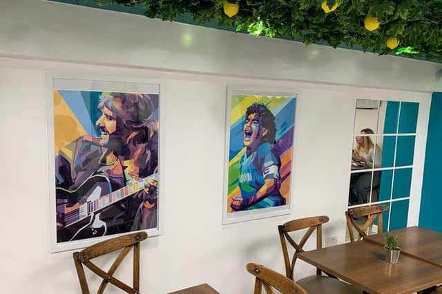 The seating area is decorated with colourful paintings and has a modern feel, while the artificial lemon tree decorations give it an extra special touch.