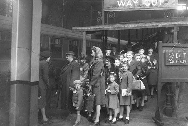 At last, war was coming to an end and these evacuees were waiting to board the train in the North East to go home to London in 1945.