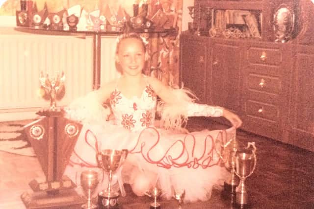 Amanda Village as a young girl with her Dancing Trophies. Credit: Wall To Wall Productions