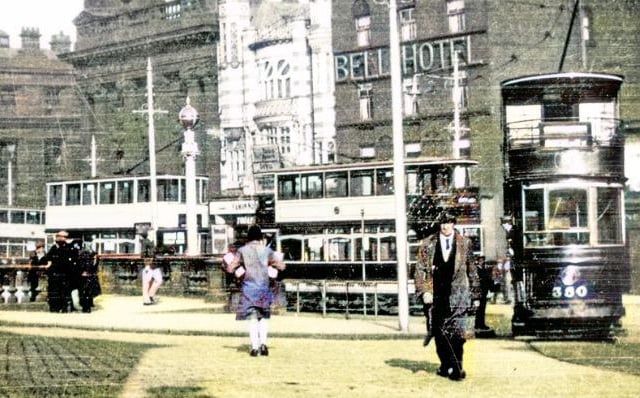 This colourised picture shows Fitzalan Square, with the Barclay's Bank, New Theatre and Bell Hotel, as well as an old style tram