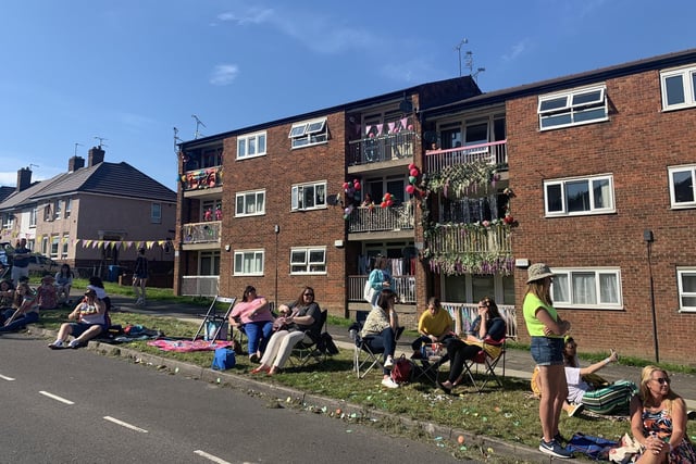 Neighbouring flats decked out with colourful balloons for an Everybody's Talking About Jamie street party on Deerlands Avenue, Parson Cross, Sheffield, where filming took place for the 2021 cinema version of the show