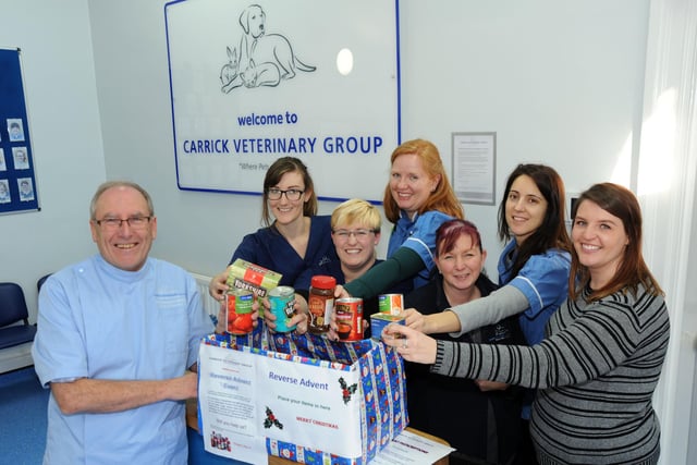 Brian Sargeant, the Clinical Director of Chesterfeld's Carrick Vets, and some of the staff, make their contributions to their homeless food hamper, which they filled on a daily basis in lieu of taking chocolates from advent calendars in 2017