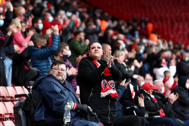 Fans watch on from the stands prior to the Premier League match between Sheffield United and Burnley at Bramall Lane in May.