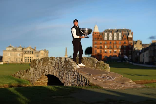 Danny Willett poses with the trophy on the Swilcan Bridge on the 18th hole following victory during Day Four of The Alfred Dunhill Links Championship (photo by Richard Heathcote/Getty Images)