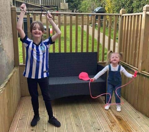 Amelia Hodkin, 7, with little sister, Harper, 2, who joined in with her skipping challenge