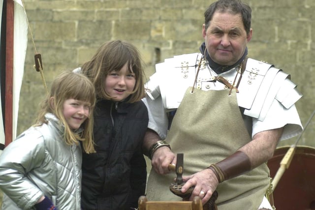 Roman  soldier and cobbler Marcus Londinius Cato (John Smith ) of the Legio 11 Augusta   at Bolsover Castle with Penny and Chloe Prince in 2001