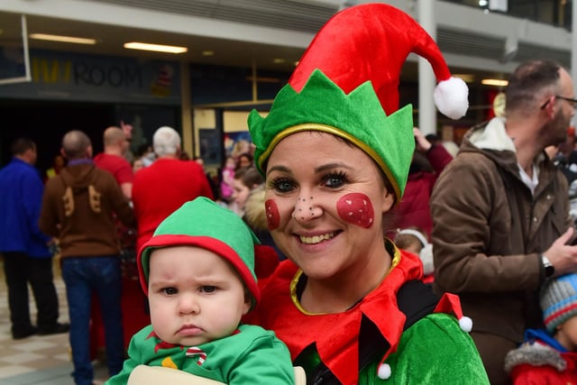 Kelly Pearson and little helper Honey Day (10 moths) at Santa's parade.