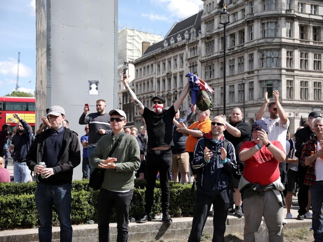 Following a social media post by the far-right activist known as Tommy Robinson, members of far-right linked groups have gathered around statues in London.  (Photo by Dan Kitwood/Getty Images)
