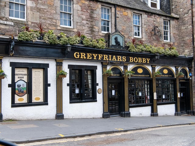 Iconic Greyfriars Bobby bar in Candlemaker Row, Edinburgh, is currently a sad sight as it remains firmly closed since social distancing measures were introduced. Bobby, the Skye Terrier statue, has been spotted wearing a medical mask for 'protection'