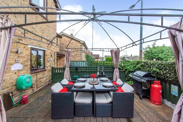 Large gazebo covered decked area for outdoor eating and socialising with outdoor electric power sockets, blue tooth connectivity and blue tooth speakers.