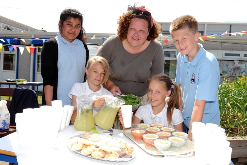 Laygate Community School pupils with horticultural artist Emma Norris. They were pictured in 2013 while they were using garden produce they had grown in the school's garden.