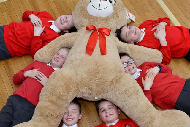 Sacred Heart Primary school pupils Leon Thompson, Joe McNally, Joseph Muncher, Frankie Webb, Joseph Purvis and Louca Ross are pictured with a Teddy Bear three years ago, but who can tell us more about the event?